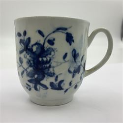 Two 18th century Worcester porcelain coffee cups, the first example decorated in the Plantation pattern, circa 1754, the second decorated in the Mansfield pattern, circa 1760, with workman's mark beneath, each approximately H5.5cm