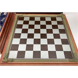 Danbury Mint 'The Fantasy of the Crystal' chess set consisting of mythical pewter chess pieces within a wooden case with chess board lid, together with 16 additional chess pieces in a wooden display case.