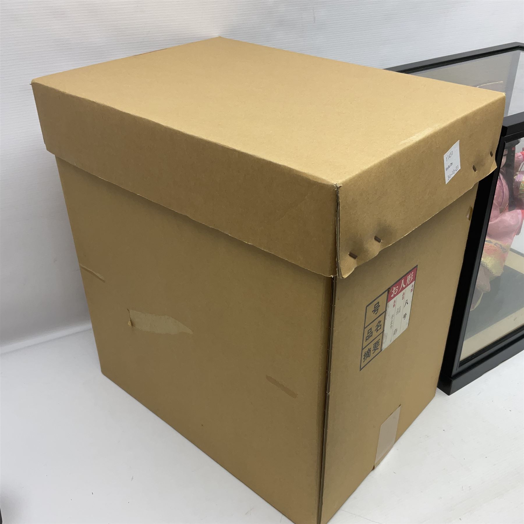 Japanese doll, dressed in traditional Japanese dress, within wooden glazed box, box H40cm