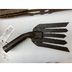 Blue and red painted gas powered bird / pest scarer, bearing label 'Exid bird & pest scarer, imported by C.R.E.A.C.O Hadleigh, Essex', , copper and brass Cymag gas hand pump, three eel spears and a set of badger tongs. Auctioneer's Note: These traps are sold as artefacts for ornamental purposes only as the use of some of them is illegal.