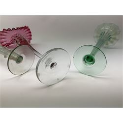 A Victorian Vaseline glass trumpet vase, with crimped rim and trailed frilled decoration, H26cm, together with a 20th century example, and a Victorian cranberry glass Jack-in-the-pulpit vase. (3). 