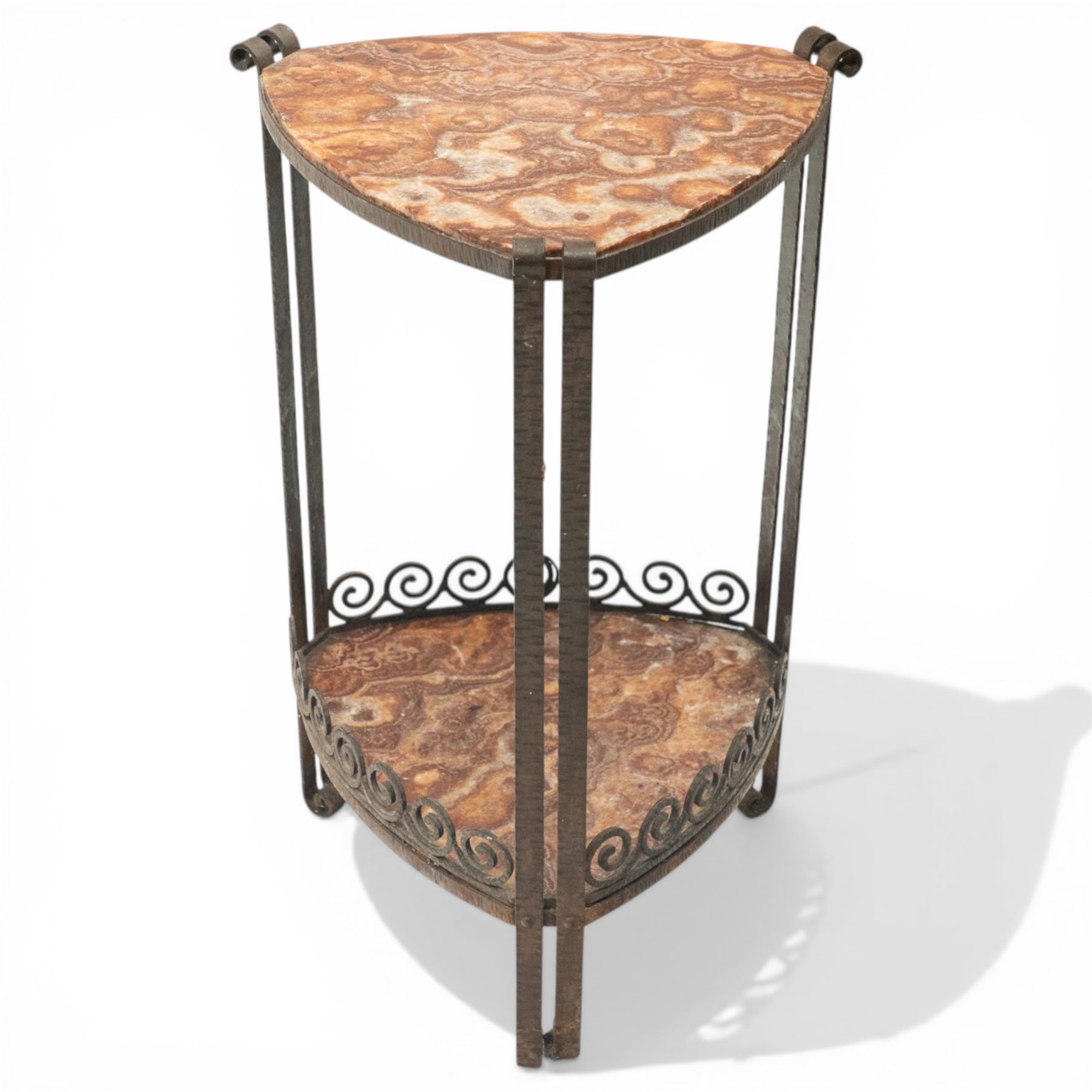 Art Nouveau wrought metal and specimen marble two-tier occasional table, the triangular marble top raised on strap metal uprights with scroll capitals, the under-tier with raised Vitruvian scroll design gallery