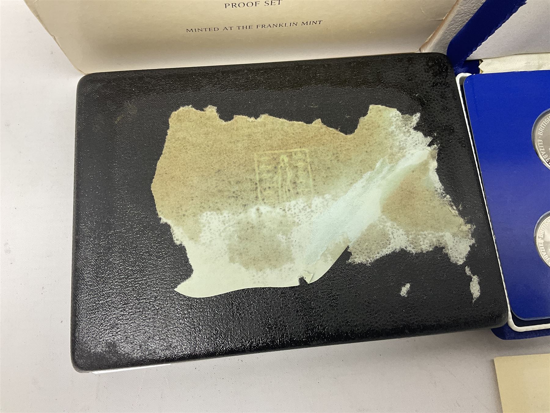 Four British Virgin Islands proof coin sets, comprising First Coinage of the British Virgin Islands 1973 proof six coin set, containing silver one dollar coin, 1977 and 1979 proof sets, containing high denomination silver coins, and The Royal Coronation Jubilee 1977 six coin silver proof set, each minted at the Franklin Mint, all cased with certificates, and a Solomon Islands 1978 proof seven coin set, containing silver five dollar coin, minted at the Franklin Mint, cased with certificate (5)