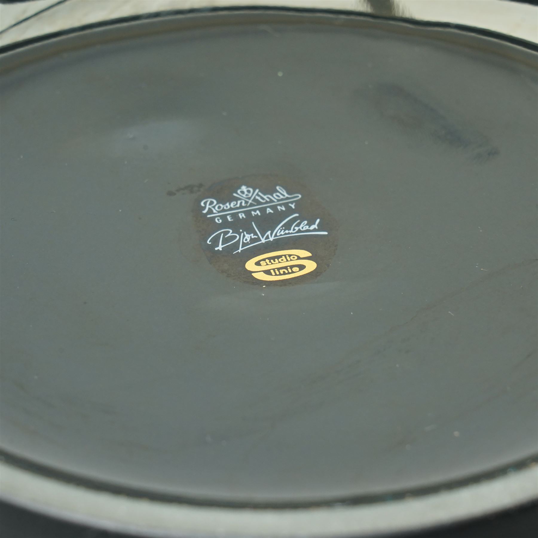 Tapio Wirkkala and Bjørn Wiinblad for Rosenthal - bowl decorated in light relief with goddesses, H15cm; together with two vases from the Porcelaine Noir series, larger H31.5cm (3)