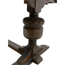 20th century oak drawer leaf extending dining table, two foliage carved baluster supports on sledge feet joined by floor stretcher 