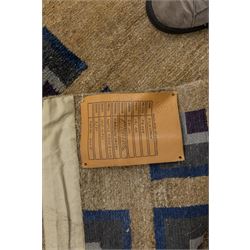 Rugs by Design - ‘Silk Stone’ Nepalese thick pile wool rug, with plain textured camel ground and geometric border detail in blue, grey and dark tones to two sides
