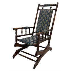 Early 20th century turned beech American rocking chair, upholstered seat, back and arms