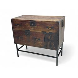 Late 19th century Japanese tansu chest, crafted with a cedar frame and cypress wood panels, original iron fittings throughout, comprising a single long drawer above smaller drawer and hinged cupboard door enclosing two smaller internal drawers and storage compartment, mounted on a bespoke black metal stand