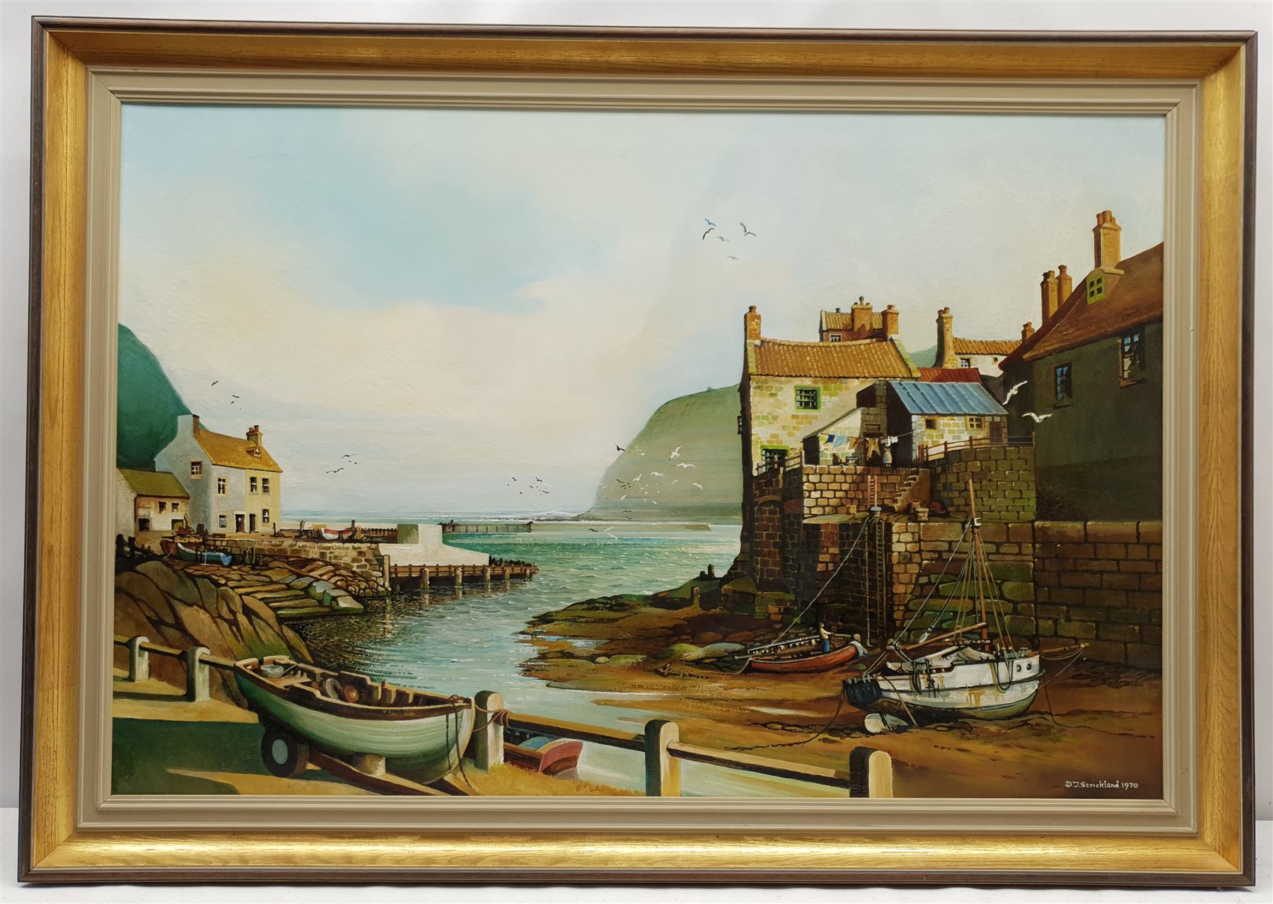 D J Strickland (British 20th century): Staithes from Cowbar Bank, oil on canvas signed and dated 1970, 59cm x 90cm