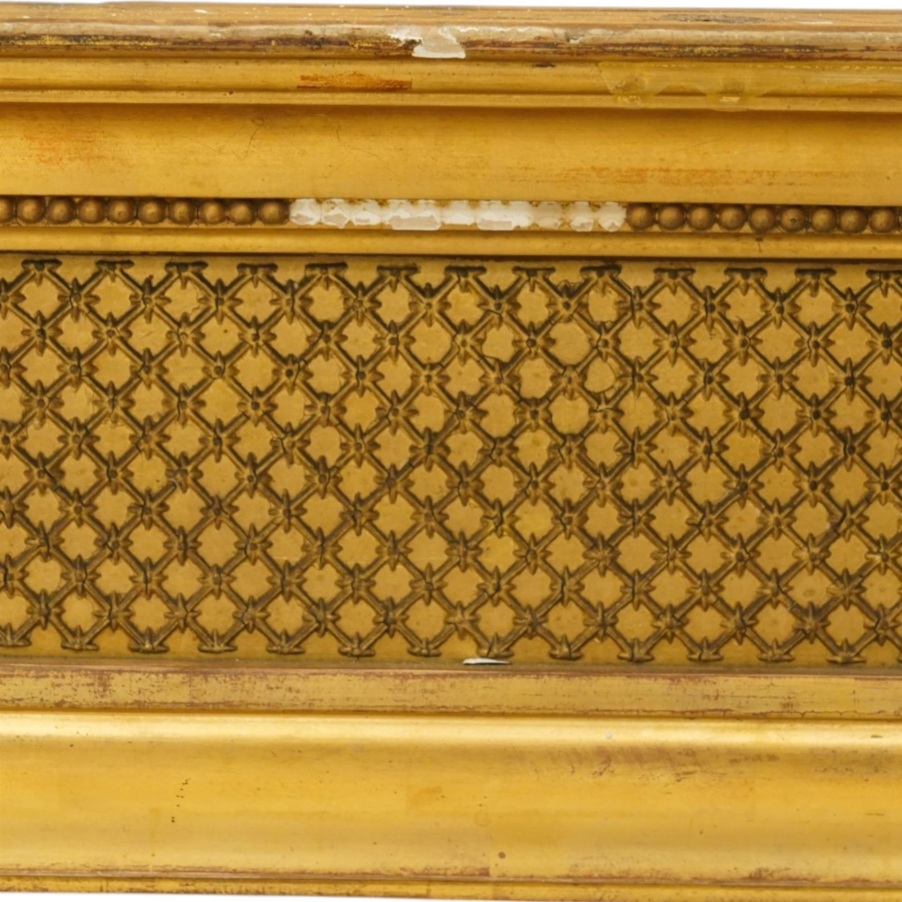 Regency style giltwood and composition tripartite overmantel mirror, rectangular frame with stepped cornice above a pierced geometric frieze, central mirror plate flanked by narrow etched floral side plates, with applied rosette paterae and moulded borders