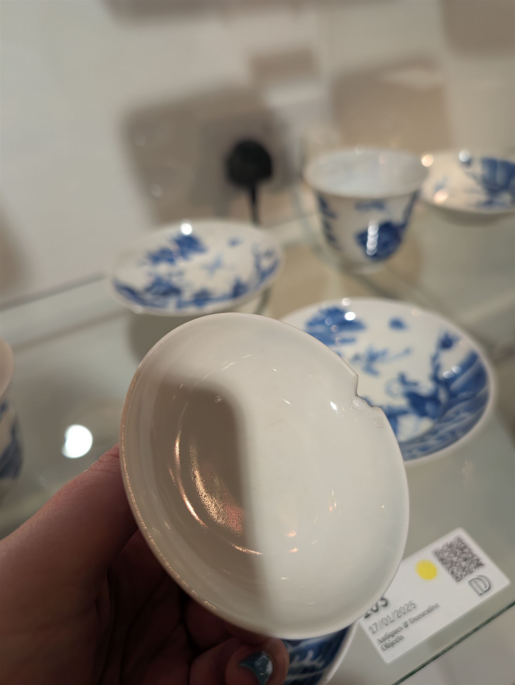 Pair of Chinese blue and white tea bowls, one with cover and four saucers, depicting two figures on a boat at sea, tea bowl H7cm