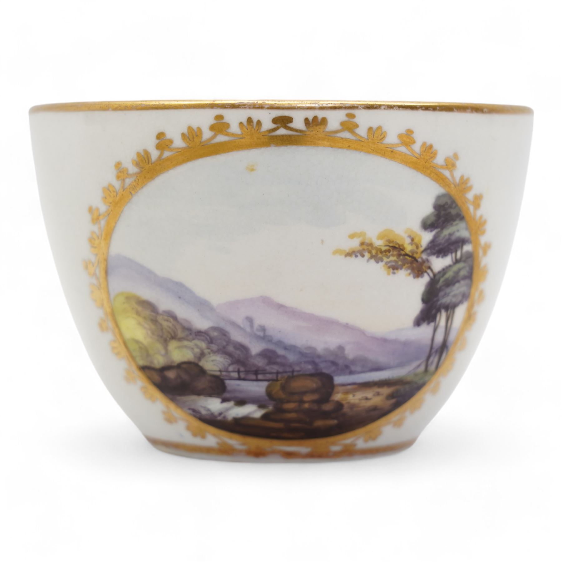 Set of four Pinxton porcelain bute shaped teacups and saucers, circa 1796-1813, pattern no. 58, painted in polychrome with circular landscape panels within gilt husks and sprigs, all saucers numbered 58 beneath, saucer D14cm, teacup H6cm (8)