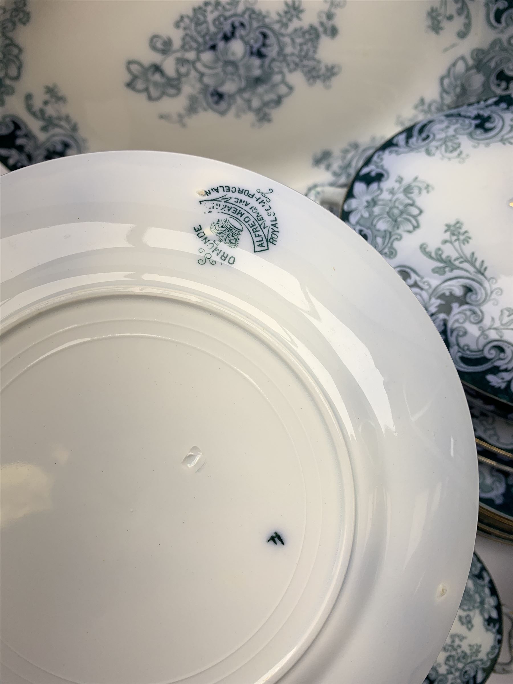 Alfred Meakin Ormonde patter dinner wares, comprising twelve dinner plates, twelve salad plates, twleve side plates, two large tureen and covers, and stands, two smaller tureen and covers and stands, and four graduated oval serving platters.  