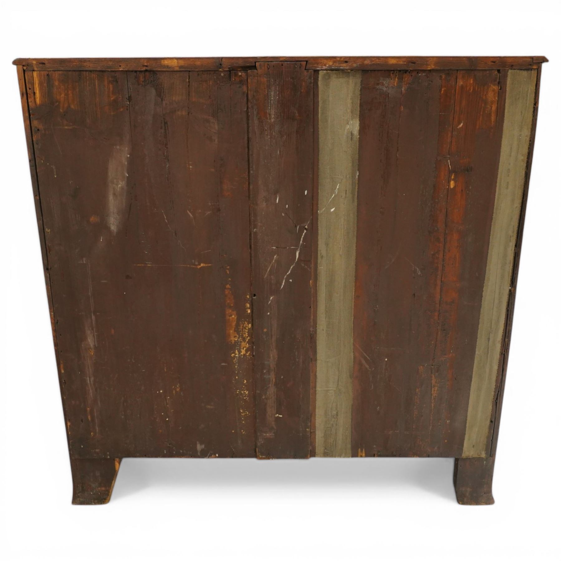 Regency period mahogany bow-front bachelor's chest, shaped top with moulded edge, fitted with brushing slide over four long graduating drawers, each with original pressed brass handle plates, raised on splayed feet 