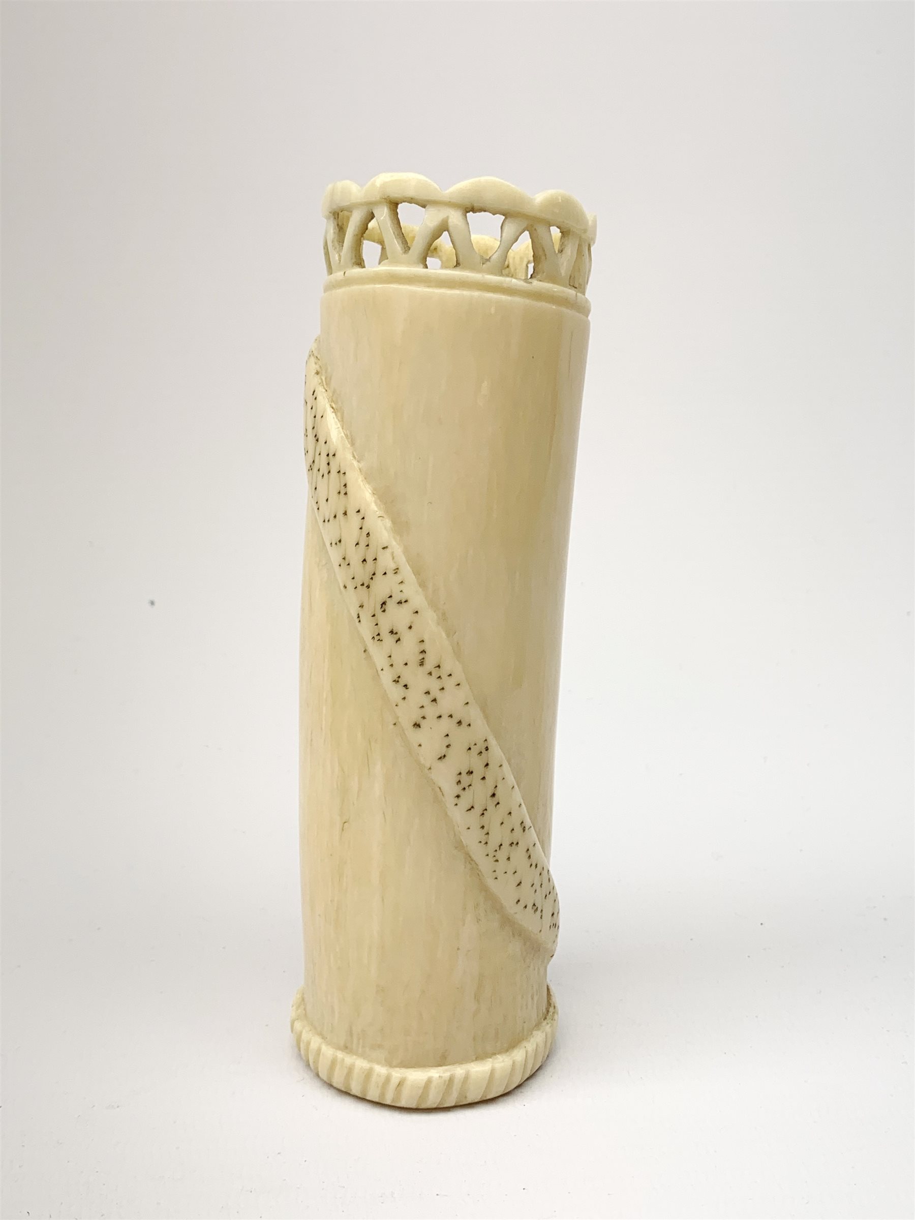 An African carved ivory spill vase, of cylindrical form with pierced rim and gadrooned band to base, the body decorated with snake and insect, signed to interior, H14cm.