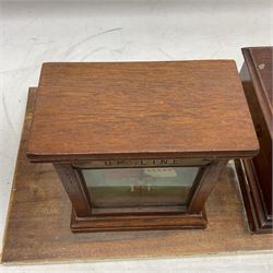 Railway signal boxes, mounted on plinth, with railway block indicators for Up Line and Down Line, having an electromagnetic indicator showing 'Train on Line' 'Line Clear' and 'Line Blocked', and brass signal bell to the centre, L100cm