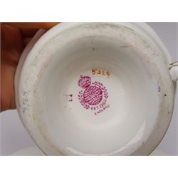 19th century Minton tea set, comprising twelve teacups, eleven saucers, fifteen side plates, cream jug, slop bowl, and two cake plates, decorated with panels of floral sprays, upon a green ground, heightened with gilt throughout, with printed puce mark beneath, and pattern number 5329
