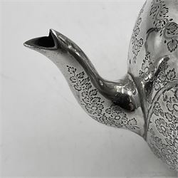 Late Victorian silver bachelors three piece tea service, comprising bullet shaped teapot, open sucrier and milk jug, each engraved with monogram surrounded by birds upon and amidst a blossoming vine, the teapot with scroll capped curved wooden handle and wooden finial to cover, hallmarked Wakely & Wheeler, London 1890, teapot including handle H12cm, sucrier H5.5cm 