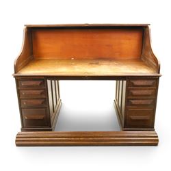 Cutler - Late Victorian oak pedestal tambour desk, the tambour shutter enclosing fitted in...