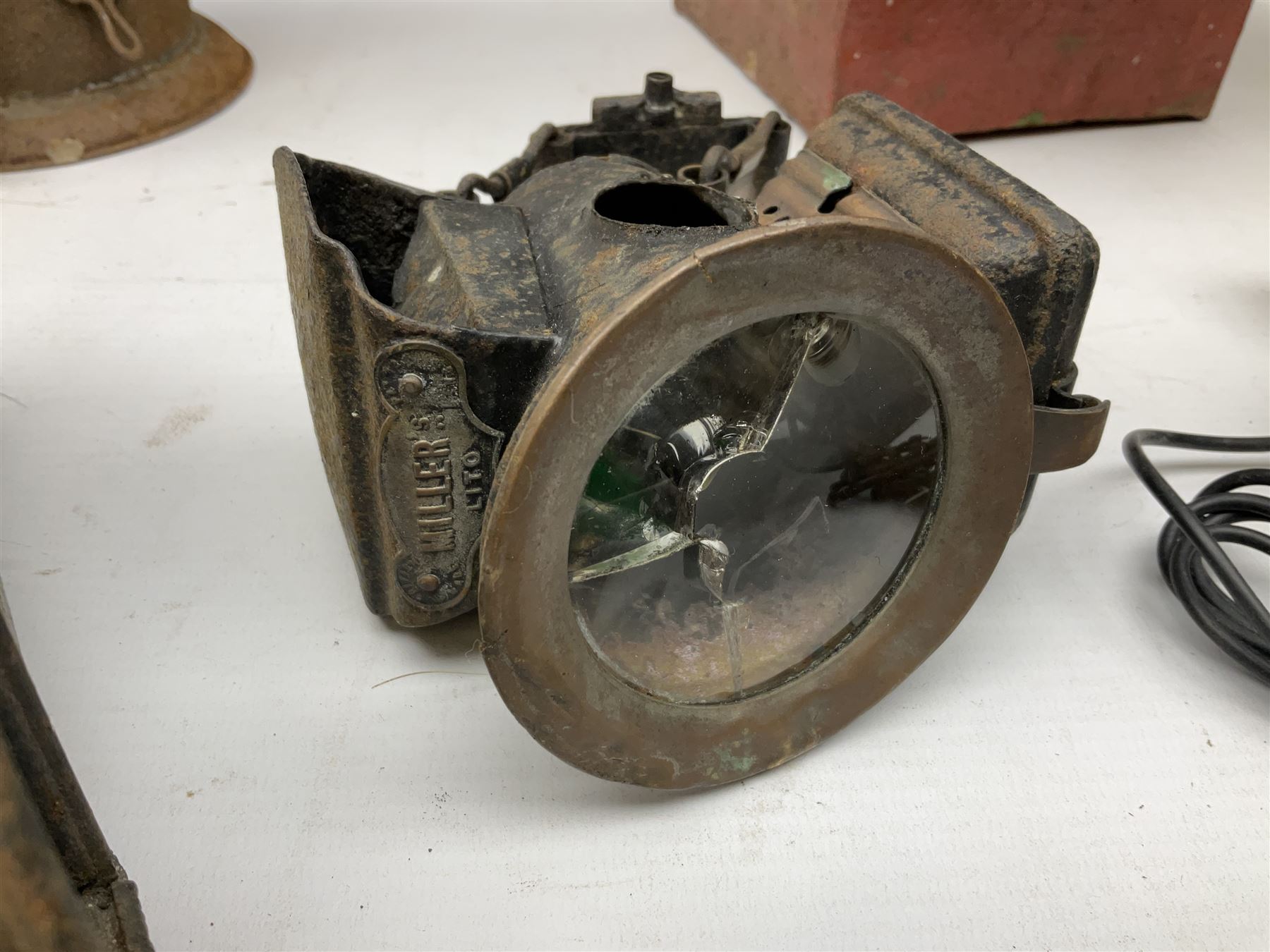 Collection of cast iron lamps, predominantly railway and coach examples, to include John Phillips Light of London Lamp Co coach lamp and Lito bicycle lamp by Miller & Co of Birmingham, etc