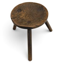 18th century ash and elm milking stool, circular figured top raised on cylindrical supports