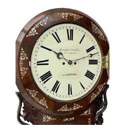 Joseph Critchley of Liverpool -  early 19th century twin fusee 8-day rosewood and mother of pearl inlaid drop-dial wall clock c1820, inlaid circular wooden dial surround with carved ears representing grapes and vine leaves, glazed box with a scroll carved surround, curved base and pendulum adjustment door, 14” painted dial with Roman numerals, minute track, and pierced steel hands within a cast brass bezel and flat glass, dial pinned to a four pillar chain driven fusee movement striking the hours on a bell. With pendulum and key.