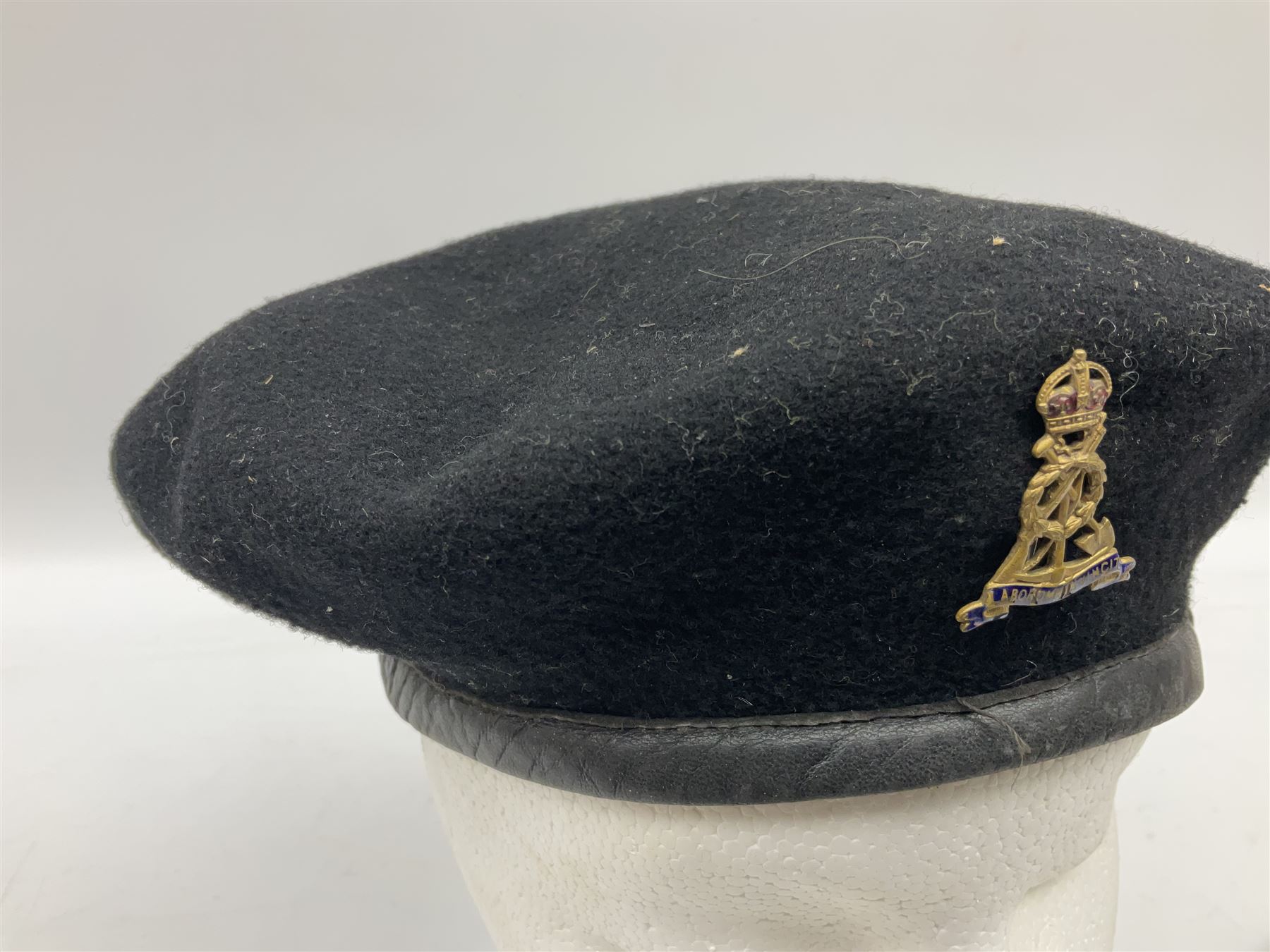 WW2 British black felt beret with Pioneer Corps cap badge, with Kangol Wear maker's mark dated 1943; and a British Army green webbing belt (2)