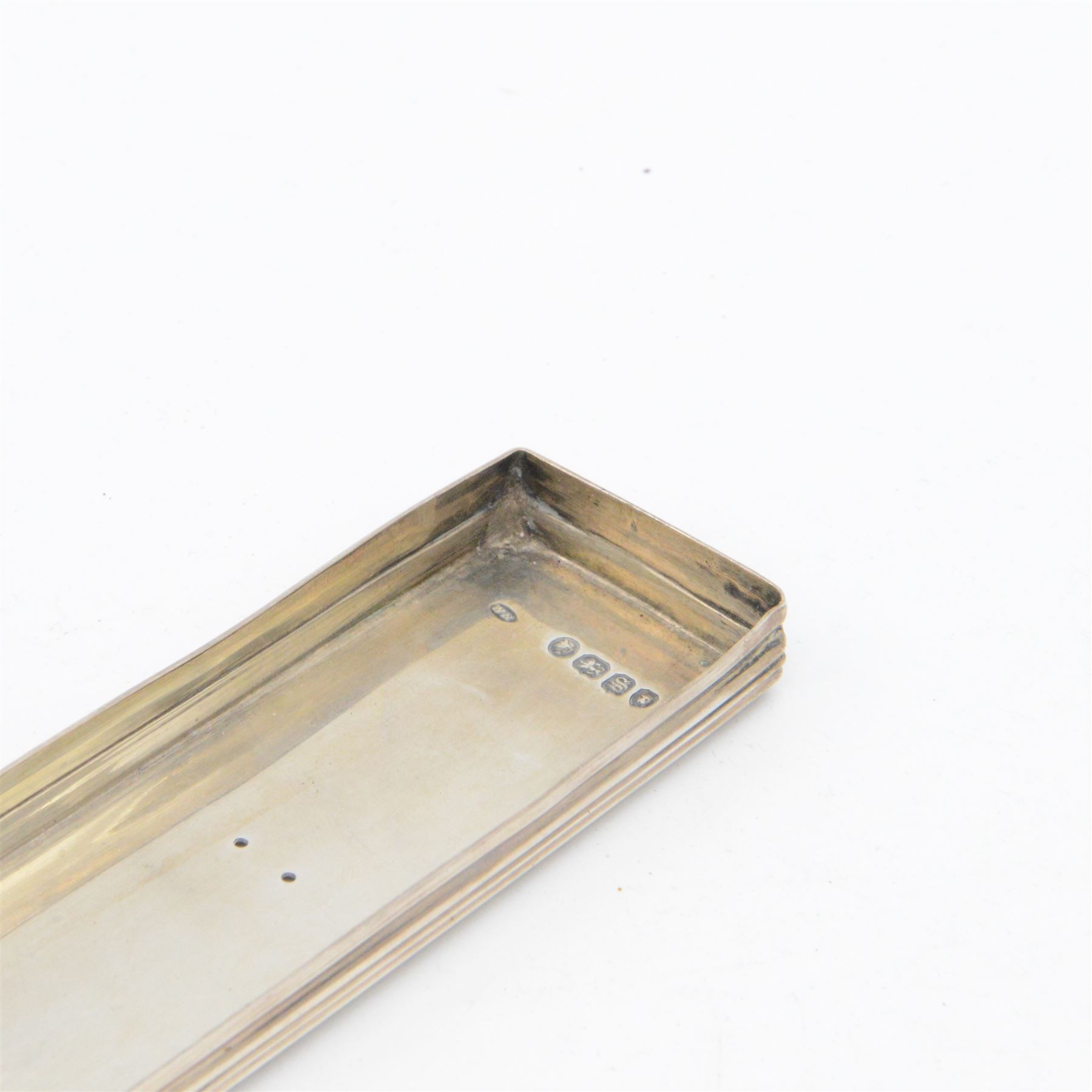 Group of silver mounted dressing table items, to include dwarf candlestick, with embossed ribbon decoration, comb holder, jar lid and six clothes brushes, all hallmarked 