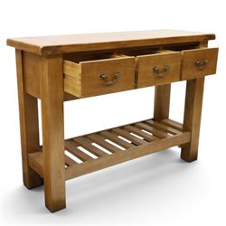 Contemporary golden ash and oak side table, rectangular top fitted with three drawers with swan-neck handles, on square supports united by slatted under-tier