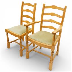 Wharfedale Traditional Furniture - oak dining table and eight ladder back chairs, circular top with stowable leaf forming a large an oval top extending to 167cm, on four splayed legs, together with eight ladder back chairs with green velour drop in seats