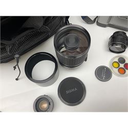Collection of camera bodies, lenses and equipment, to include Asahi Pentax Sportmatic camera body, serial no. 5311241, with 'Super-Takumar 1:3.5/135' lens, serial no. 1007135, 'Sigma Mirror-Telephoto Multi-Coated 1:8 f=600mm' lens serial no 200696, 'Takumar Sper-Multi-Coated 1:1.4/50' lens, serial no. 5677171 and other equipment