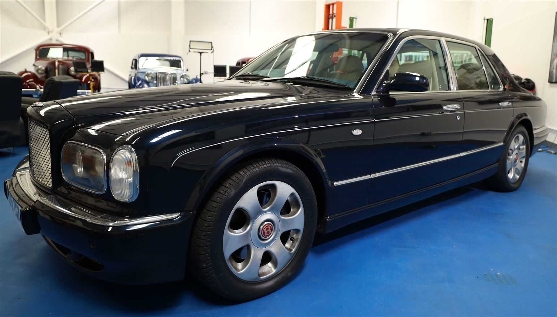 2001 Bentley Arnage Red Label Saloon

Registration: BU51 TGX
Engine: 6.75-litre turbocharged V8 petrol
Transmission: Automatic
Odometer reading: 39,942 miles
Colour: Black Sapphire metallic
Interior: Magnolia leather with burr walnut veneers
Previous owners: 3
V5C: Present
Service history: Good service records

An exceptional Bentley Arnage Red Label Saloon, finished in Black Sapphire metallic, a very dark blue, with a Magnolia leather interior, contrasting dark blue carpets and extensive burr walnut veneers. The car displays an odometer reading of approximately 39,942 miles.

The Arnage Red Label combined Bentley’s renowned 6.75-litre turbocharged V8 engine with automatic transmission, delivering effortless performance in a traditionally appointed luxury saloon. The model is distinguished by its imposing proportions, characteristic Bentley radiator grille and finely crafted interior.

Presented in excellent condition throughout, the bodywork and metallic paint finish appear particularly well preserved, complemented by clean brightwork and the correct Bentley alloy wheels. The engine bay is also notably well detailed.

The interior presents exceptionally well, retaining its Magnolia leather upholstery, polished burr walnut veneers, original factory instrumentation and switchgear. The leather displays only light creasing consistent with careful use.

The car has had three previous owners and is accompanied by good service records.

Features

• 6.75-litre turbocharged V8 petrol engine
• Automatic transmission
• Black Sapphire metallic paintwork
• Magnolia leather interior
• Contrasting dark blue carpets
• Burr walnut veneers
• Electrically adjustable front seats
• Air conditioning
• Factory instrumentation and switchgear
• Bentley alloy wheels
• Right-hand drive
• Odometer reading of approximately 39,942 miles
• Three previous owners
• Good service records
• V5C present

This vehicle forms part of the Estate of the Late John Sills and is offered for sale by the Executors, confirming a genuine reason for sale.