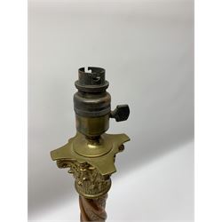 Early 20th century brass and copper Corinthian column table lamp, the square stepped brass base leading to a spiral twist copper column and brass Corinthian capital, H44.5cm 