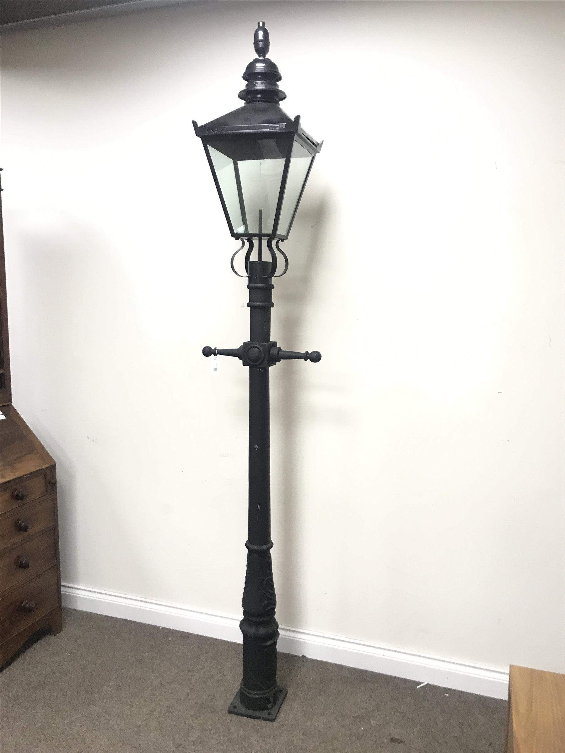 Victorian style cast iron street lamp post with glass lantern top