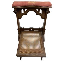 Late Victorian oak metamorphic prie-dieu chair, ecclesiastical design with pegged construction, upholstered kneel rest and top rest, hinged cane work seat
