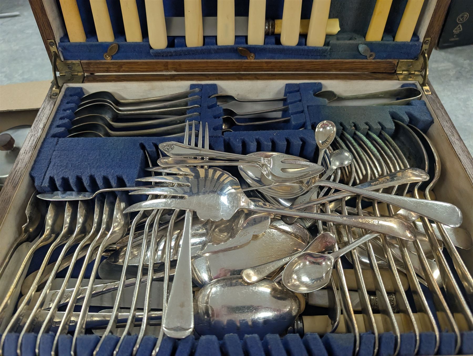 Collection of silver plate and brassware, including canteen of cutlery, horse brasses, candlesticks, teapots etc