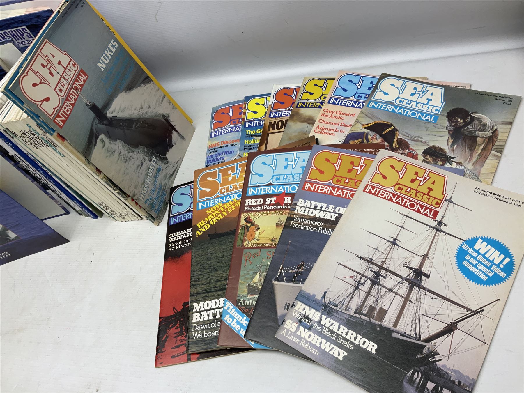Six Atlas Editions ring binders of Warships Maxi Cards; and large quantity of booklets, cigarette cards etc of naval and shipping interest