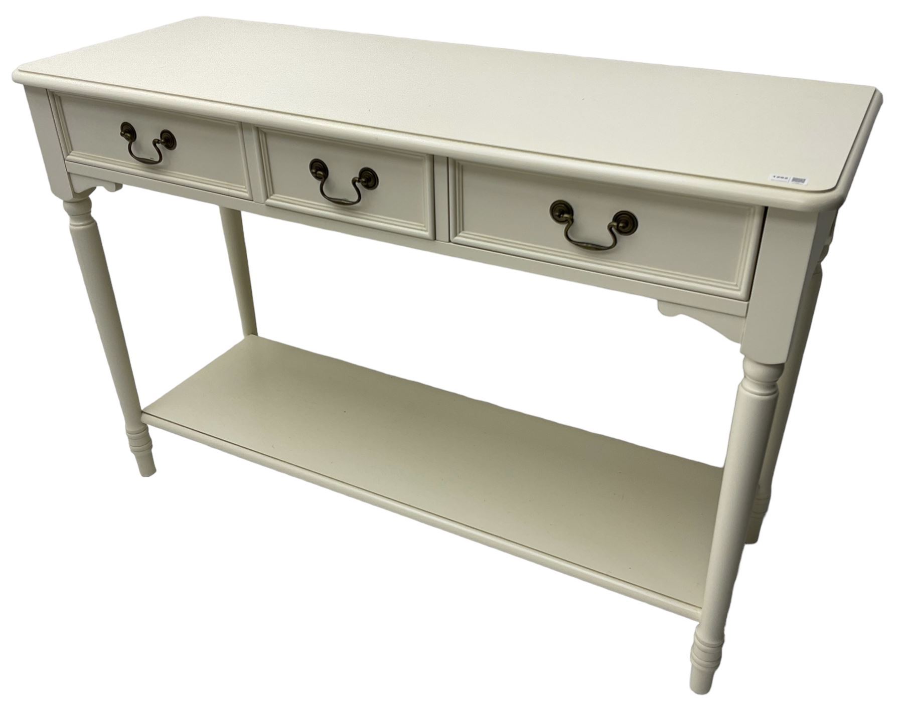 Laura Ashley - 'Clifton' ivory finish three drawer console table, fitted with three frieze drawers with heavily moulded edges, raised on turned supports united by undertier