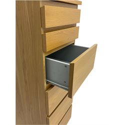 IKEA light oak finish chest, fitted with hinged vanity top, above six graduating drawers 