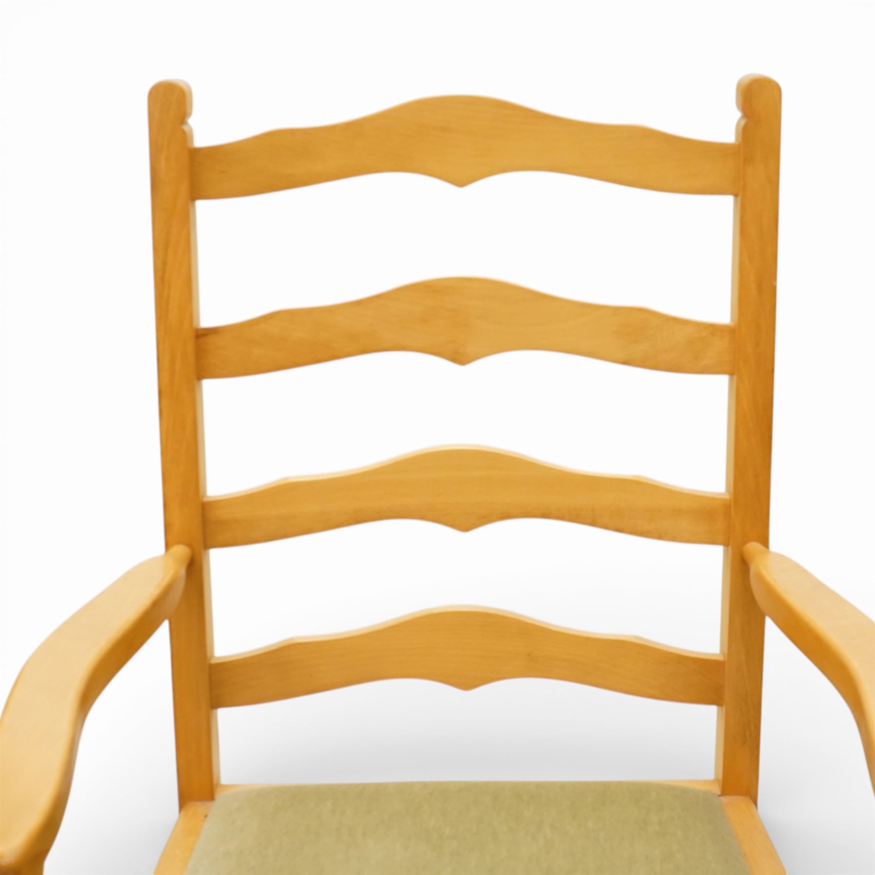 Wharfedale Traditional Furniture - oak dining table and eight ladder back chairs, circular top with stowable leaf forming a large an oval top extending to 167cm, on four splayed legs, together with eight ladder back chairs with green velour drop in seats