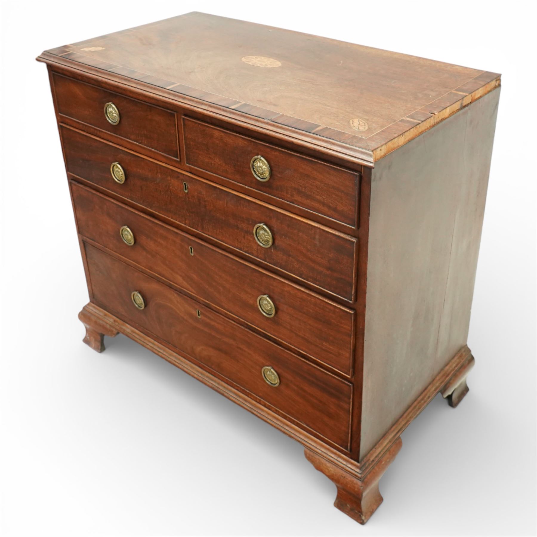 George III crossbanded mahogany chest, rectangular top with crossbanded edge and oval satinwood medallion, two short over three long graduated drawers with brass swan neck handles, raised on shaped bracket feet