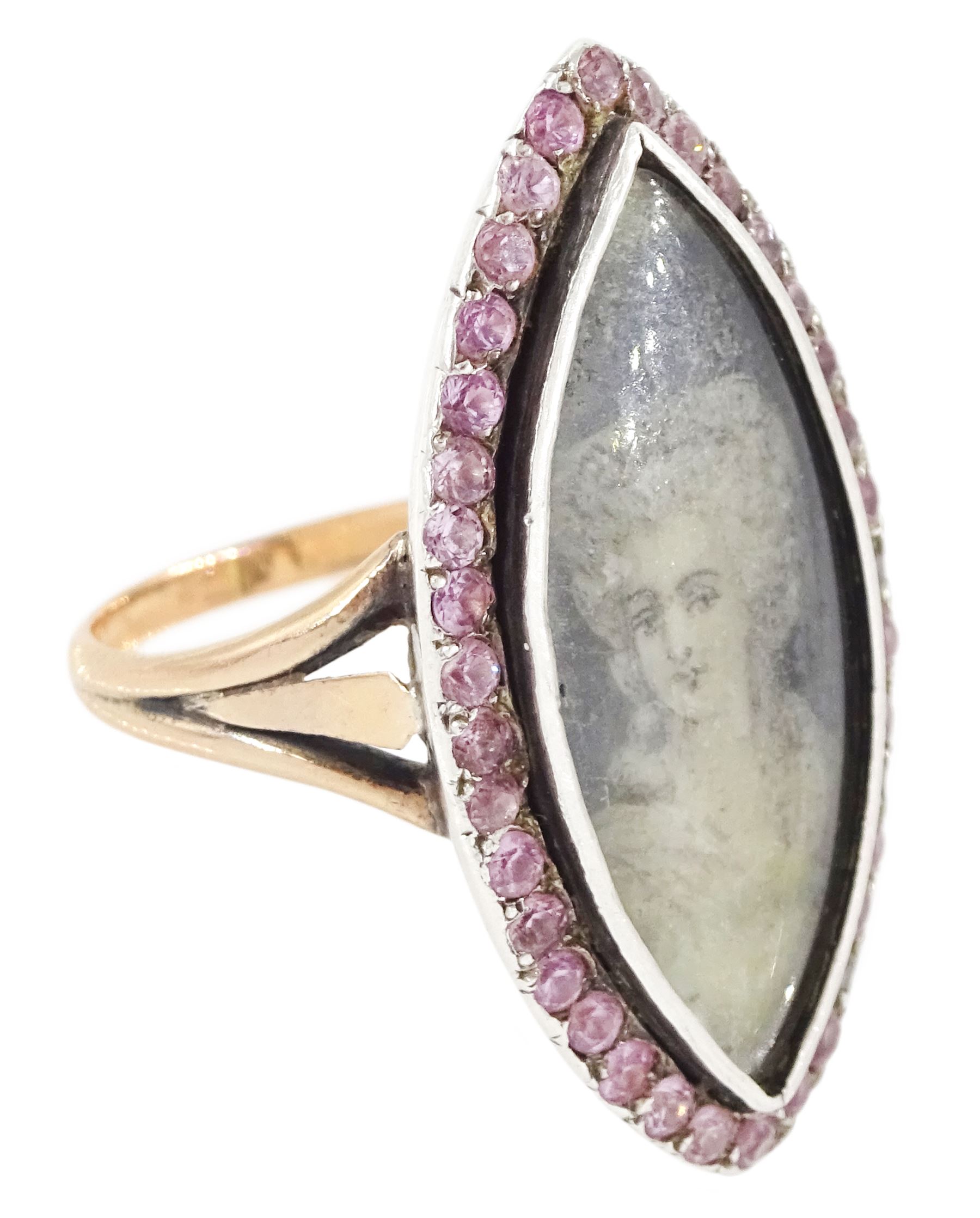 18th / 19th century gold and silver paste stone set portrait ring, the navette bezel set with a miniature of a woman on ivory, under a glazed panel, within a pink paste border and trifurcated shoulders. This lot has been registered for sale under Section 10 of the APHA Ivory Act