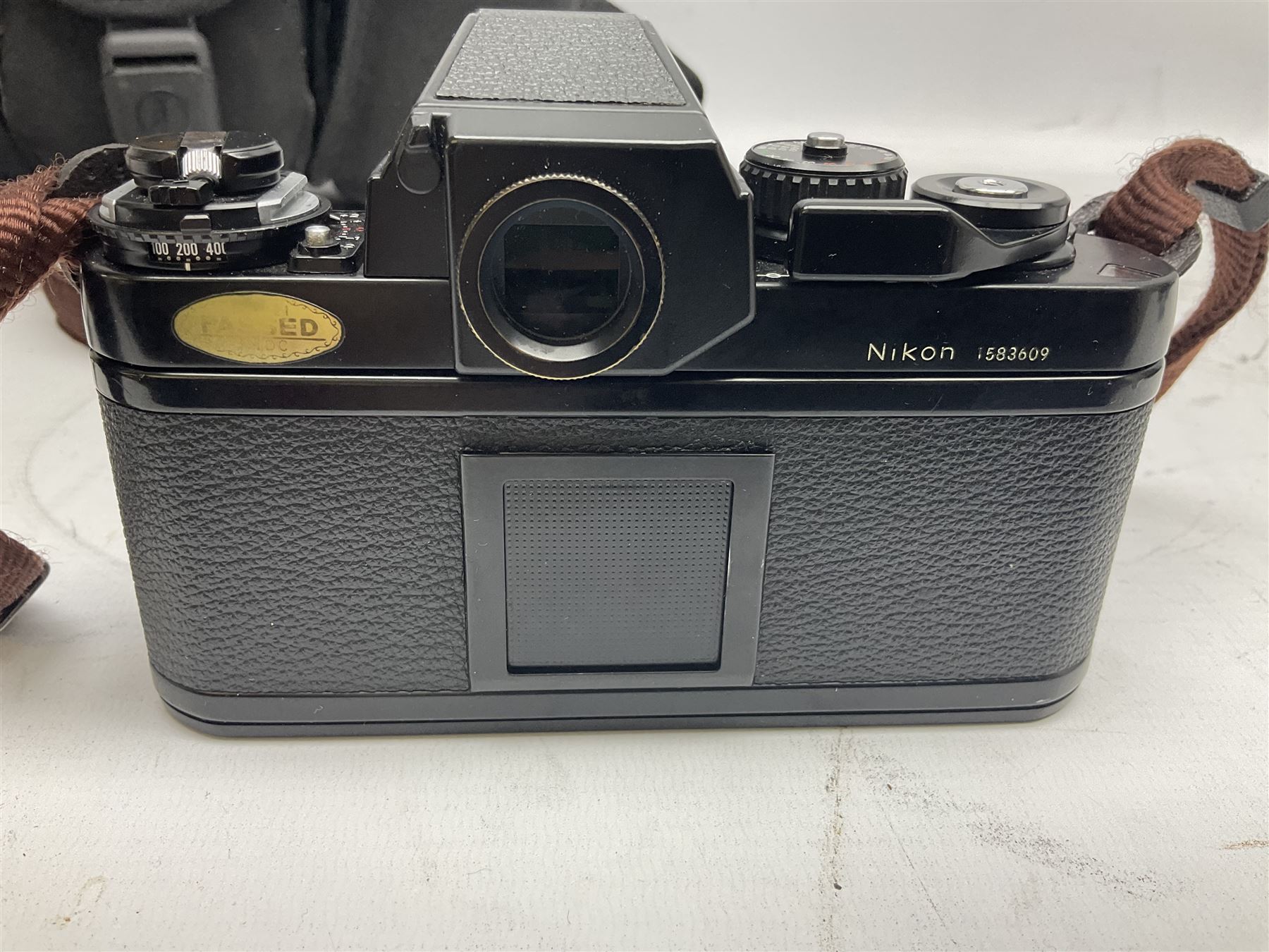 Nikon F3 SLR camera, serial number 1583609; Nikon 50mm 1:1.8 lens; Nikon 28-85mm 1:3.5-4.5 zoom lens; Vivitar MC 2X-3 Tele Converter, and a Nikon Speedlight SB-16 flash