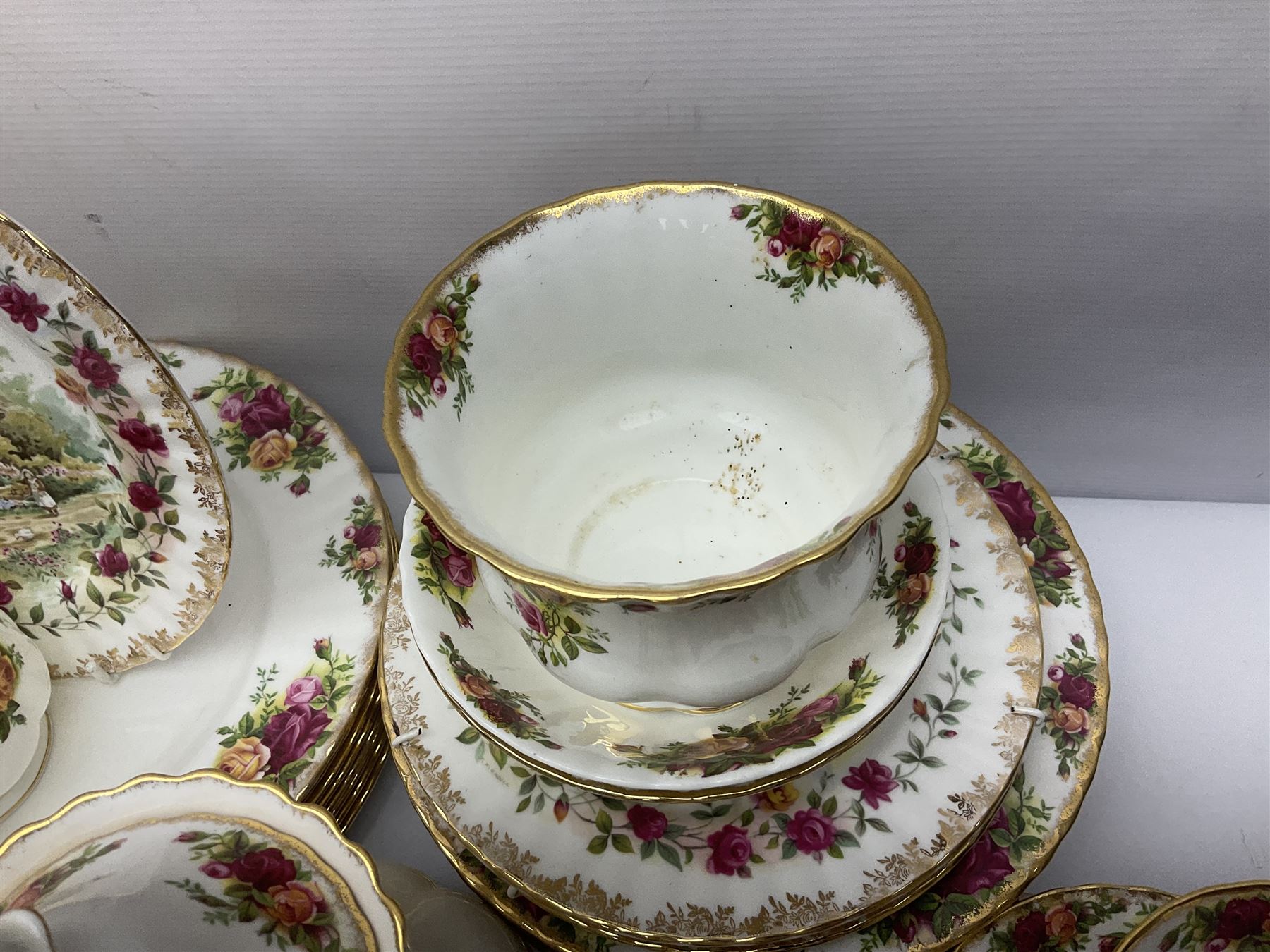Royal Albert Old Country Roses pattern part tea and dinner service, including coffee pot, miniature teapot and stand, eight dinner plates, cake stand, sauce boat etc 