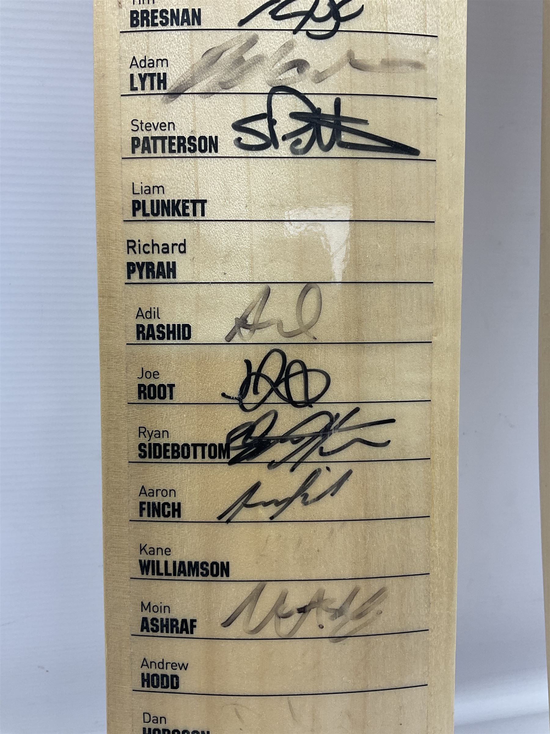 Two signed Yorkshire County cricket bats, from 2013 and 2014 seasons, bearing signatures including Johnny Bairstow, Joe Root, Tim Bresnan, Andrew Gale, etc