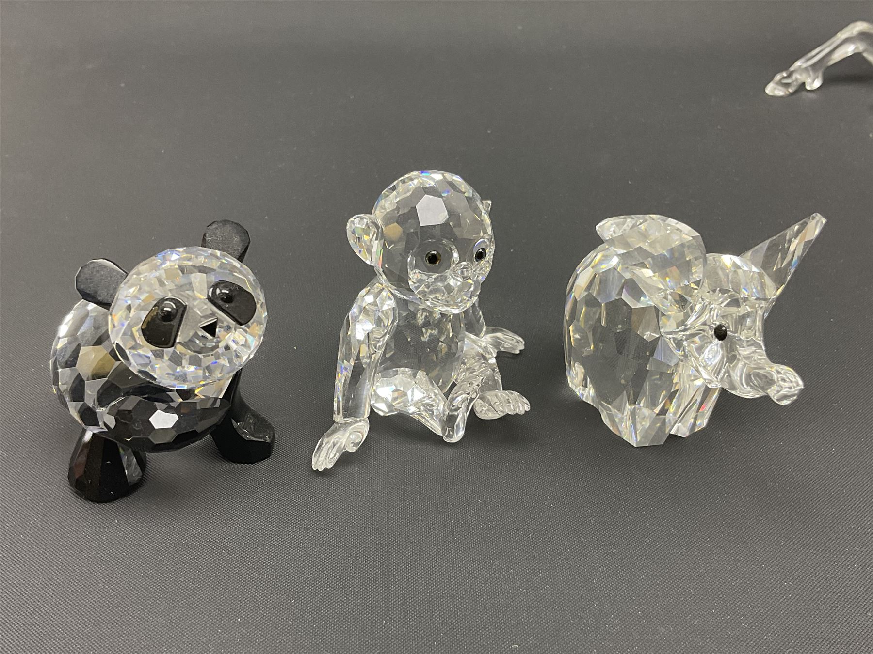 Twenty nine Swarovski Crystal animals, to include koala and baby, in frosted tree branch, elephants, polar bears, squirrel, monkeys, panda, unicorn and snails, etc 