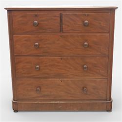 Mid Victorian flame mahogany chest of drawers, the moulded bow front top over two short and three long graduated drawers, fitted with turned wooden knob handles, flanked by rounded front corners continuing to plain sides, raised on a plinth base
