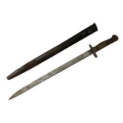 British Pattern 1907 bayonet, the 43.5cm fullered steel blade marked 'Wilkinson'; in steel mounted leather scabbard L57.5cm overall