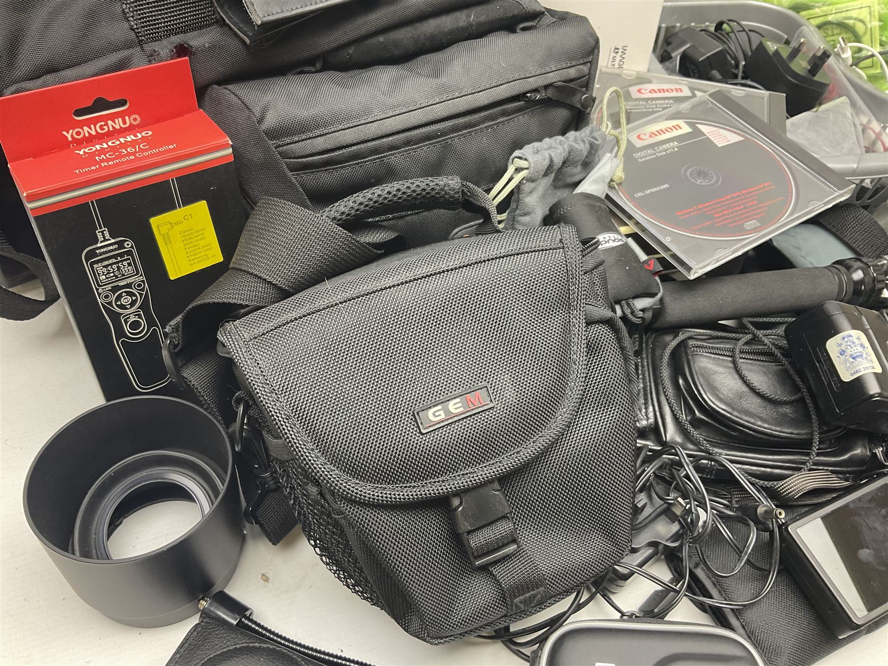 Quantity of camera accessories and equipment, to include boxed Canon EFS 17-55mm IS lens, Canon 59s camera, Olympus camera, etc