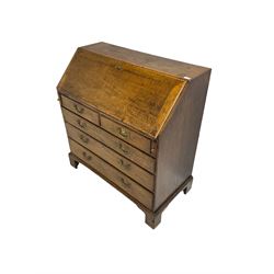 George III oak bureau, fitted with two short and three long drawers, on bracket feet